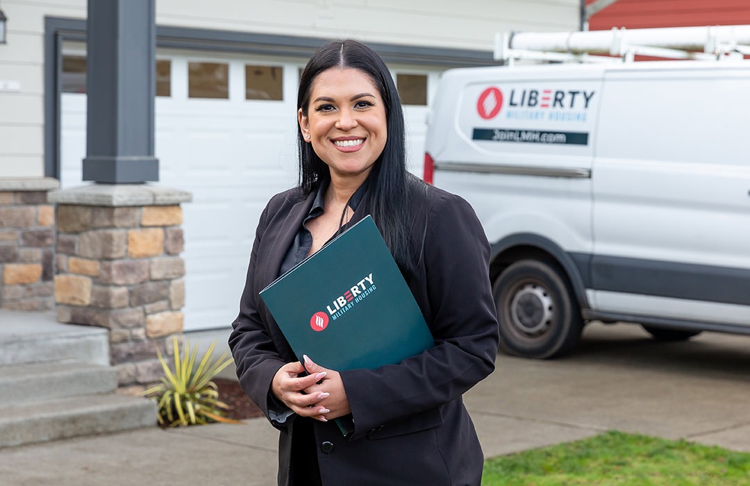 Woman standing in front of a home
