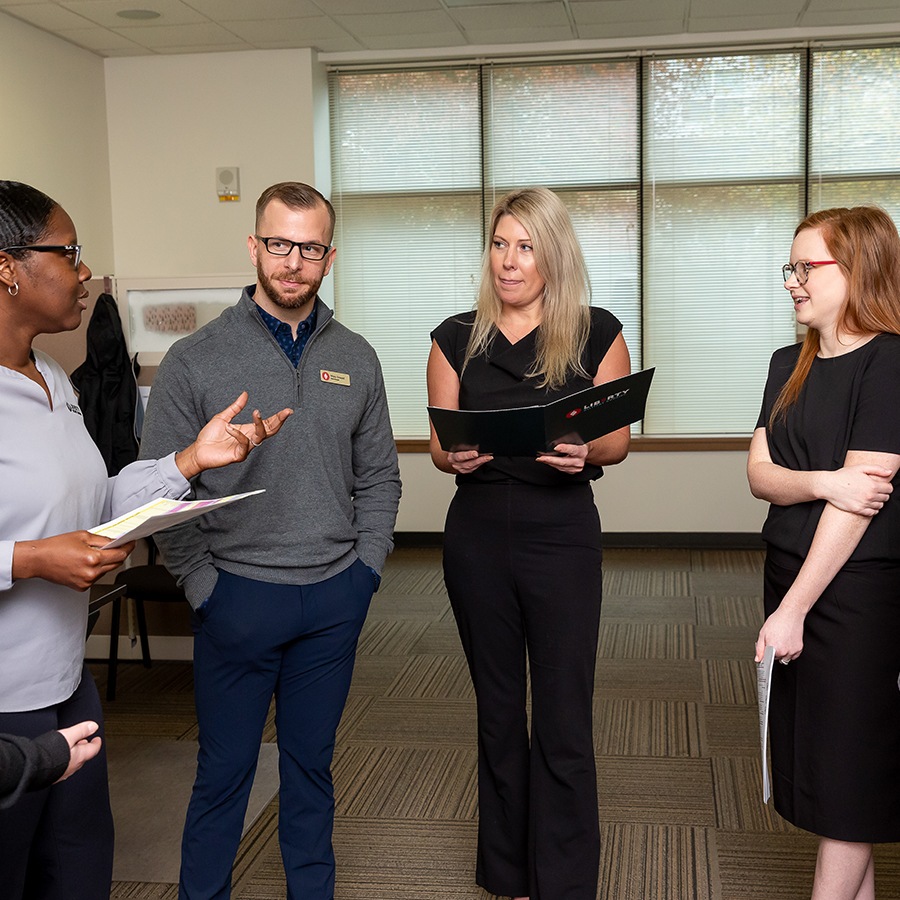 Group of people standing and talking 