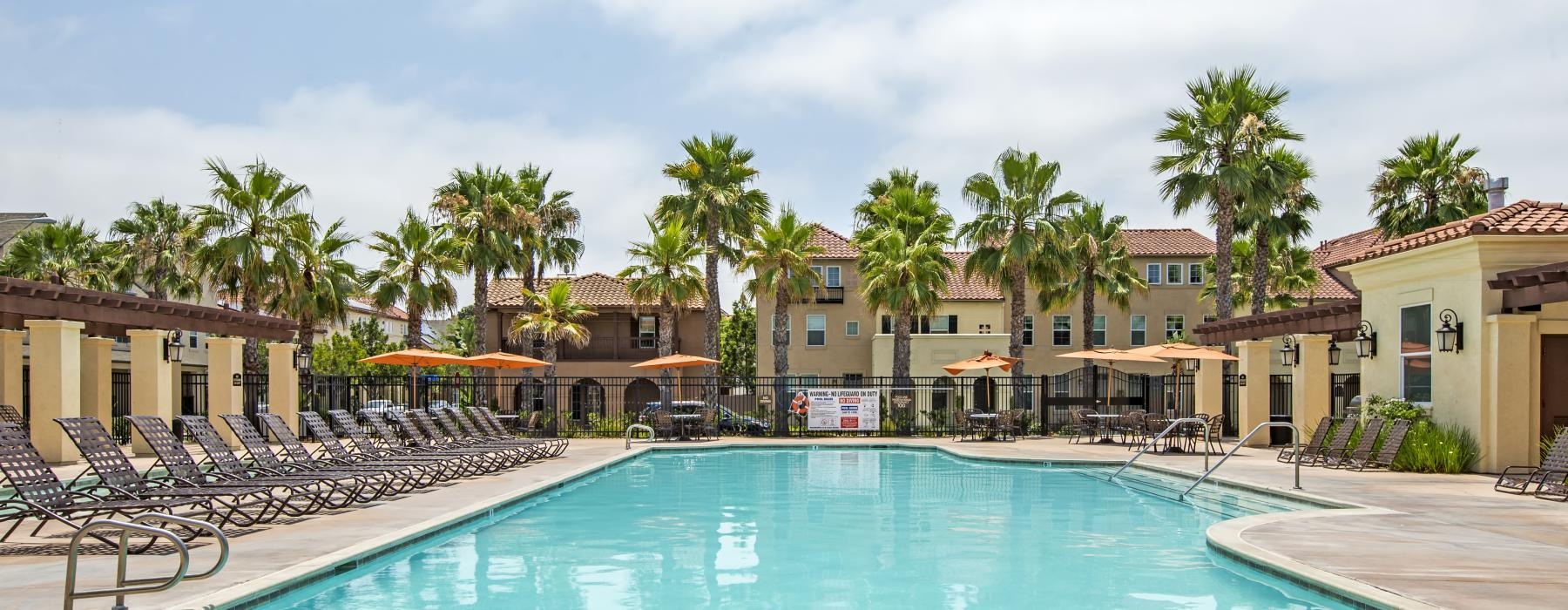 a pool with chairs around it