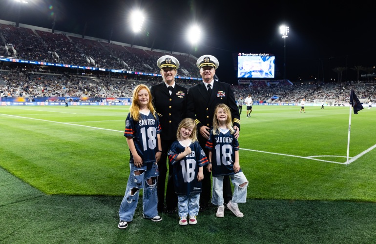 Commander Rebecca Adams and Matt Adams and family