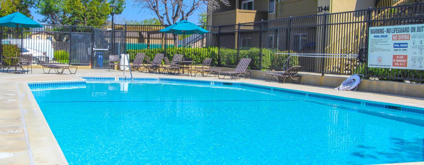 a swimming pool in front of a house