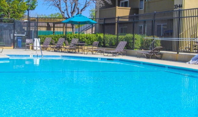 a swimming pool in front of a house
