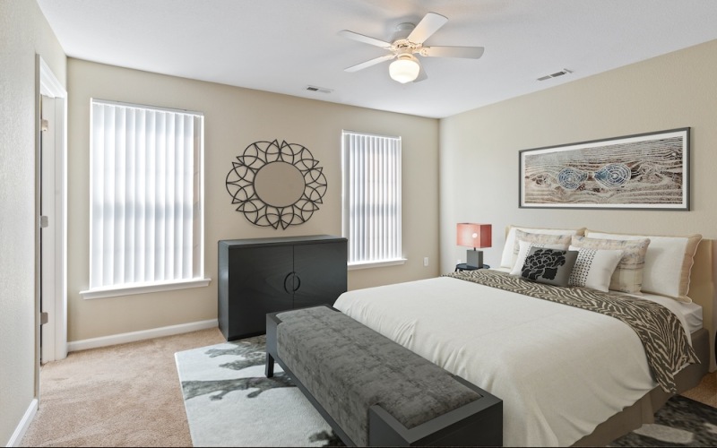 Bedroom with natural lighting and high ceilings