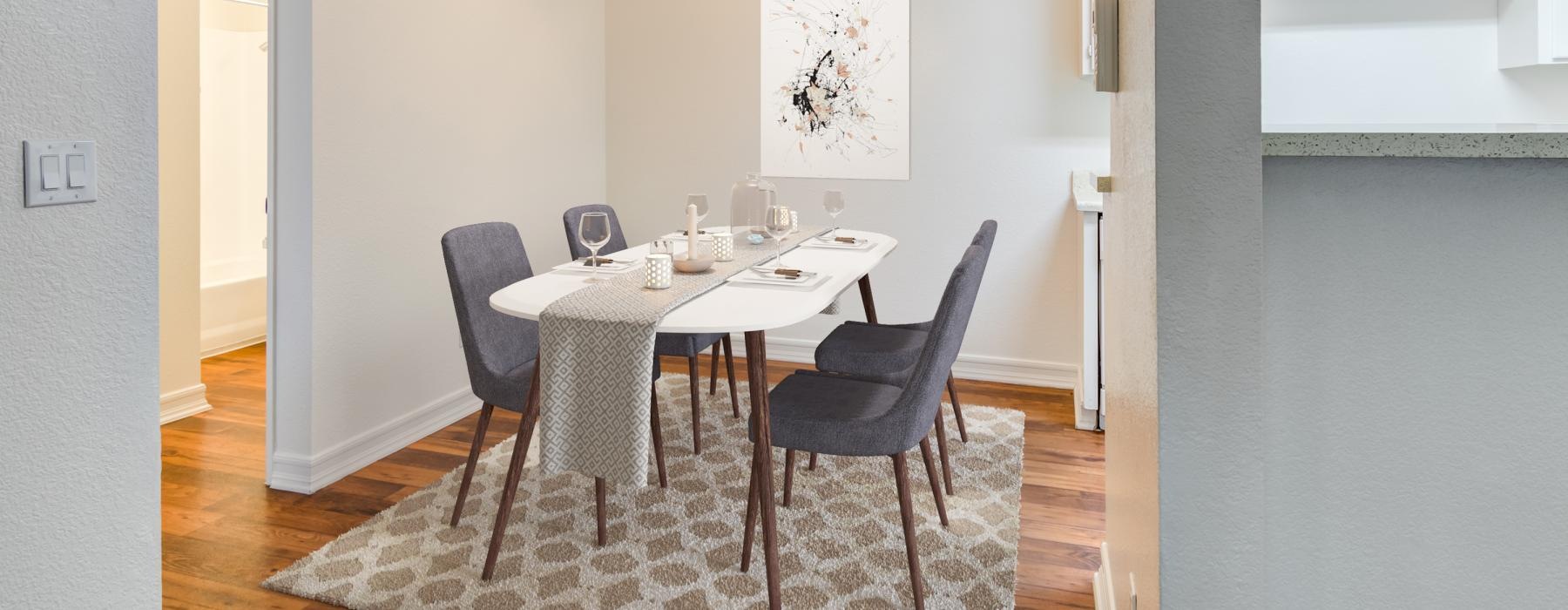 a dining room table with chairs