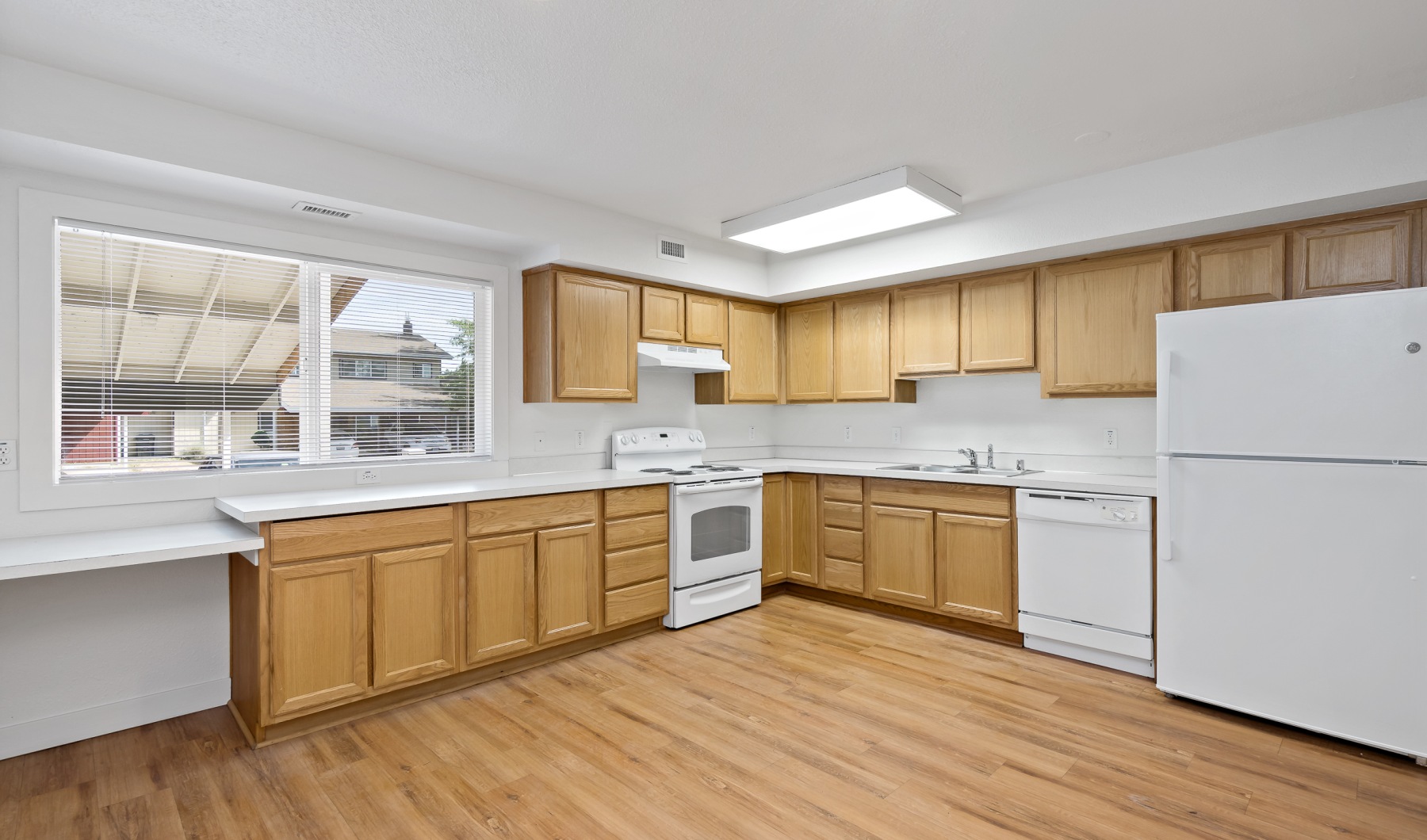 a kitchen with wooden cabinets