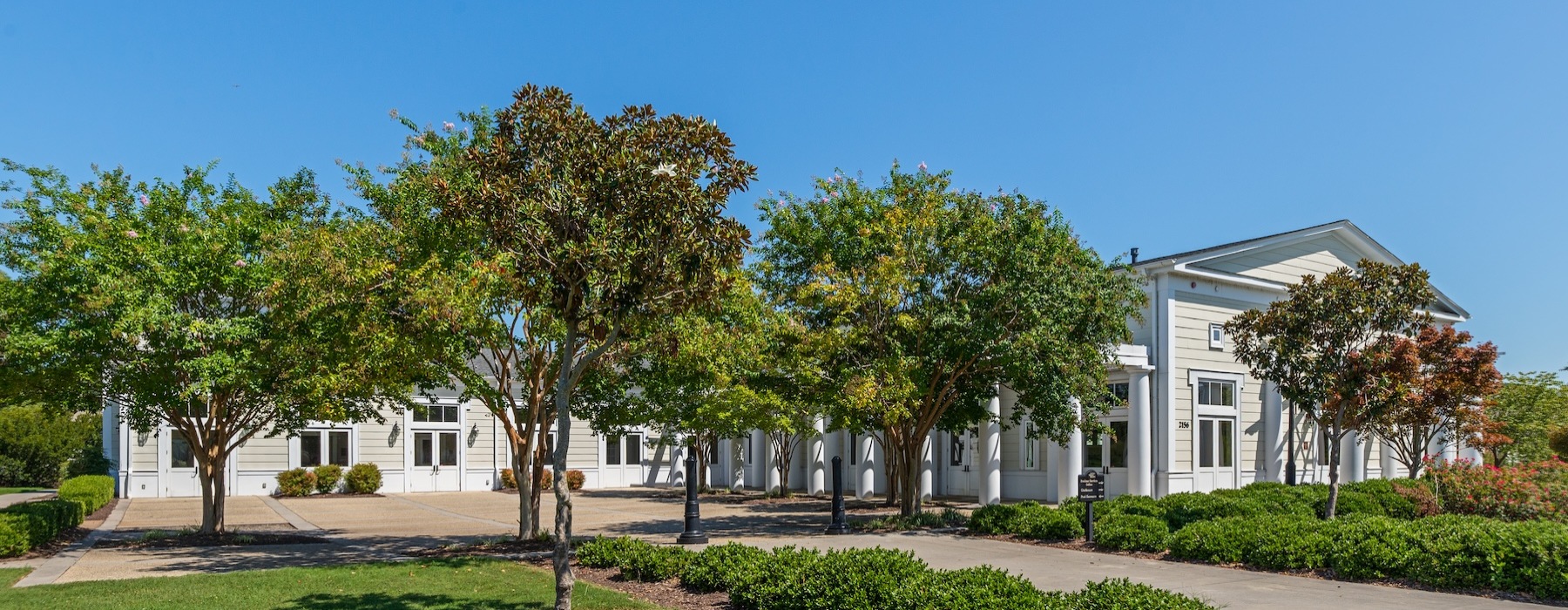 the exterior of a building with trees
