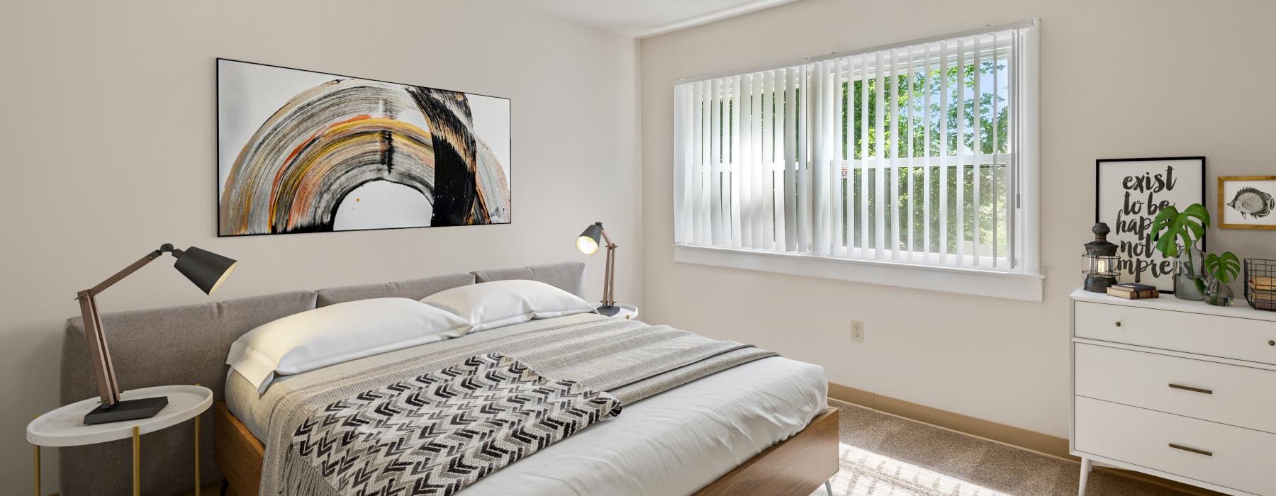 a bedroom with a bed and a painting on the wall