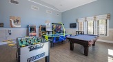 a room with a pool table and air hockey table