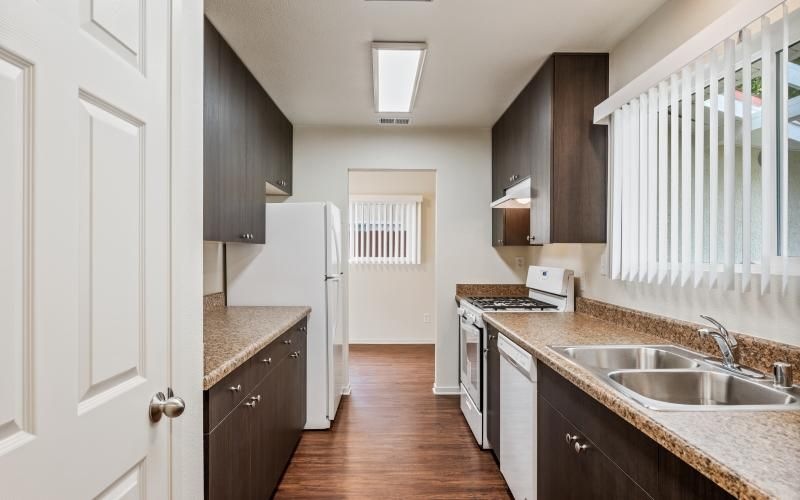 a kitchen with a wood floor