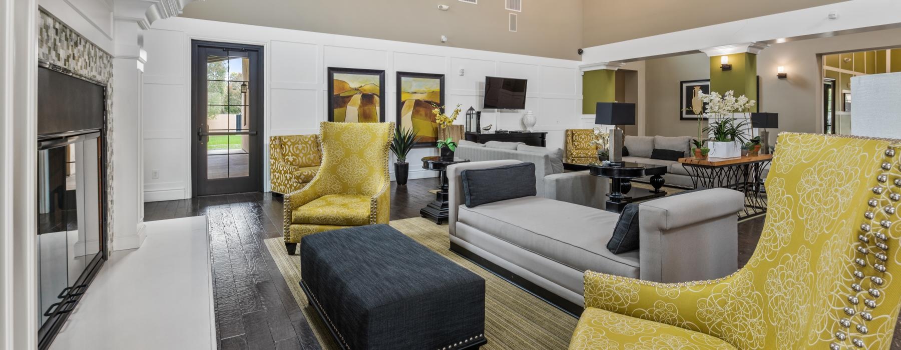 a living room with a couch and chairs