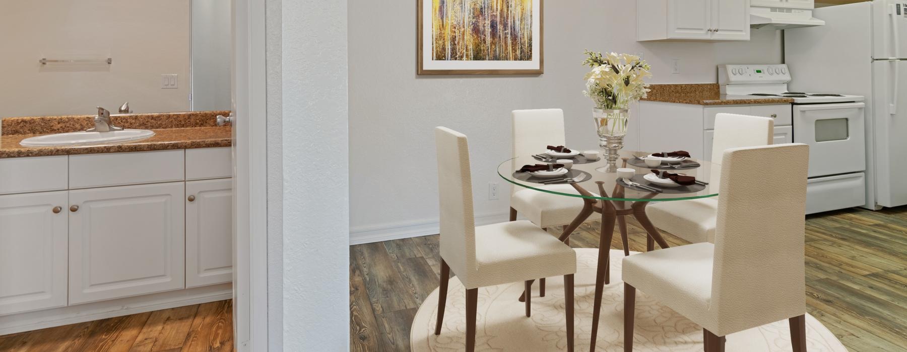 lighted dining area next to a bathroom