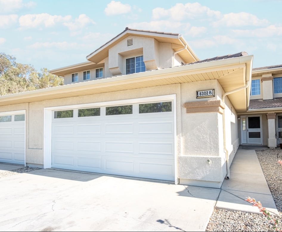 a house with a driveway and garage