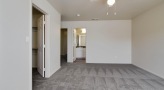 a room with a ceiling fan and a door