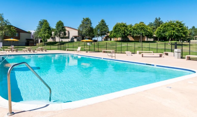 a swimming pool with a fence around it