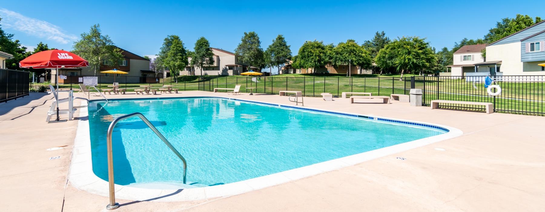 a swimming pool with a fence around it