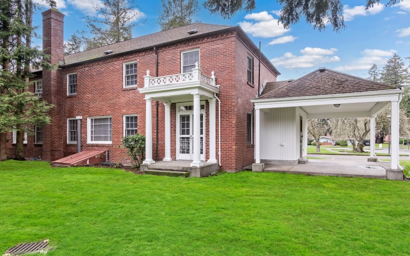 a brick house with a front yard