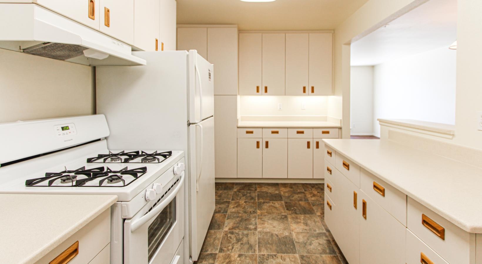 a kitchen with white cabinets
