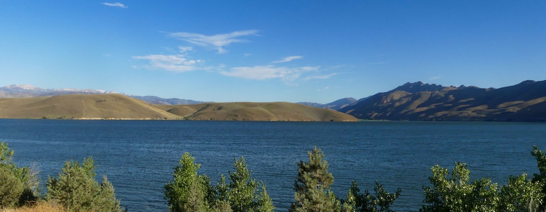 a view of a lake with mountains in the background