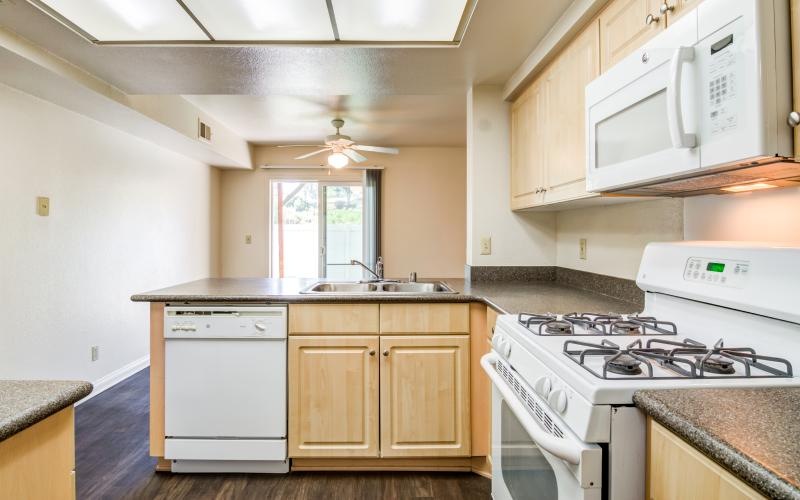 a kitchen with white cabinets