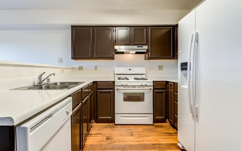 a kitchen with white appliances