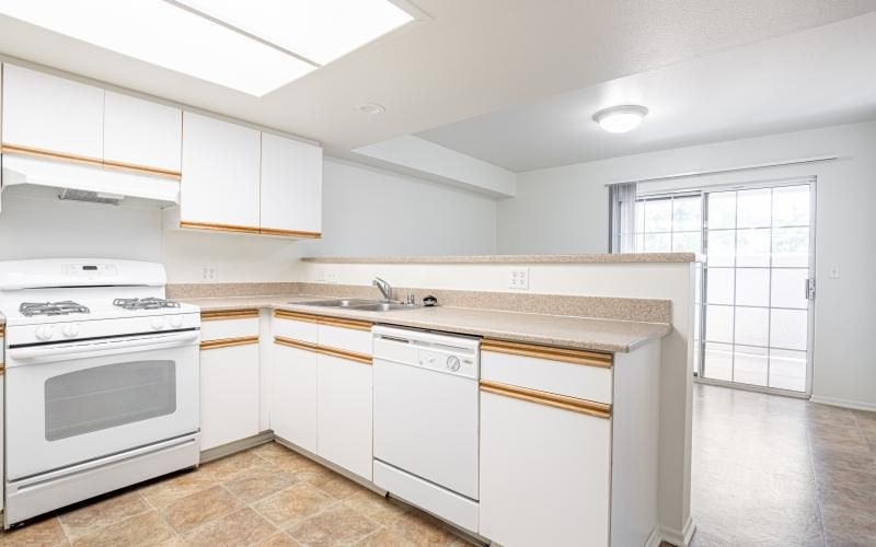 a kitchen with white cabinets