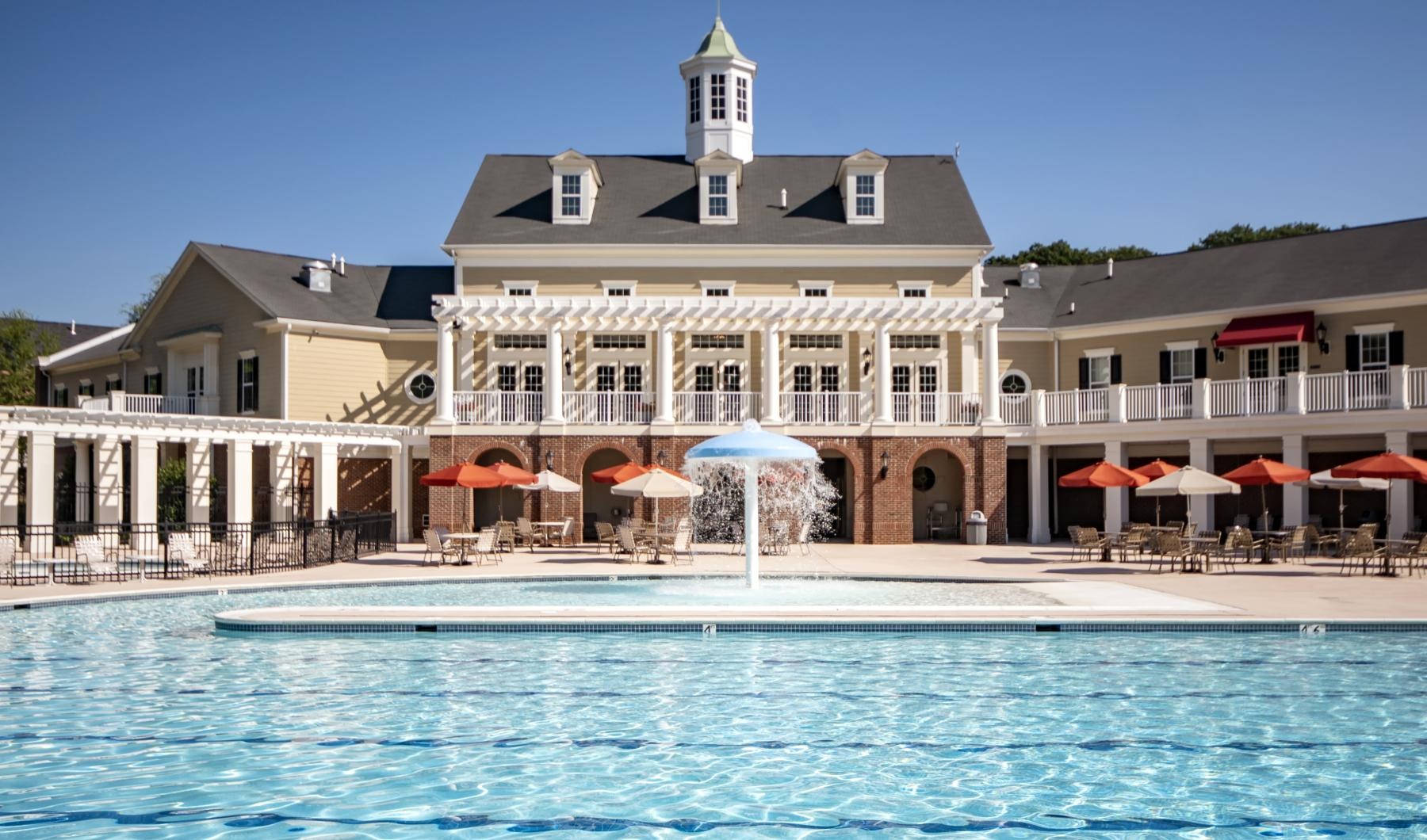 a pool in front of a building