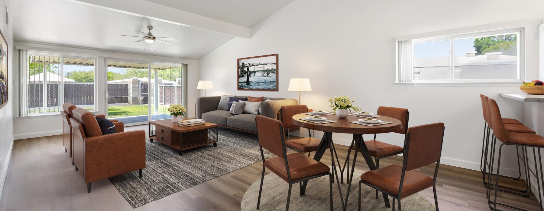 a living room with a table and chairs