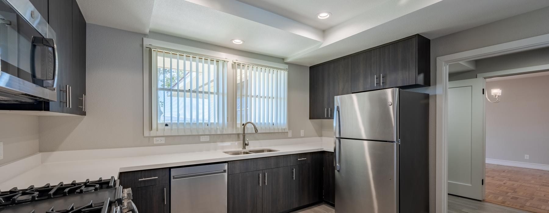 a kitchen with black appliances