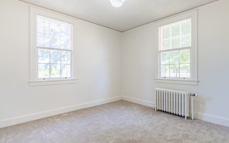 bedroom with carpet and windows