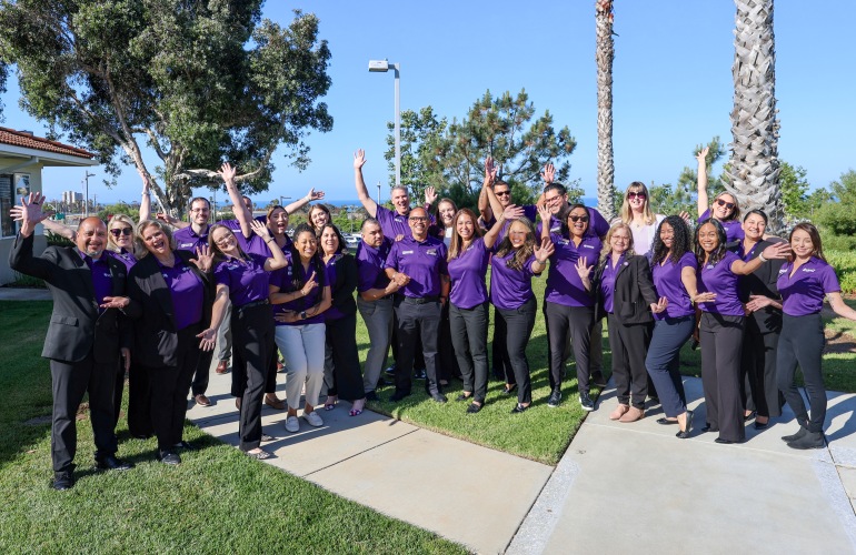 Liberty Team Members In Purple Polos