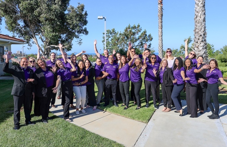 Liberty Team Members In Purple Polos