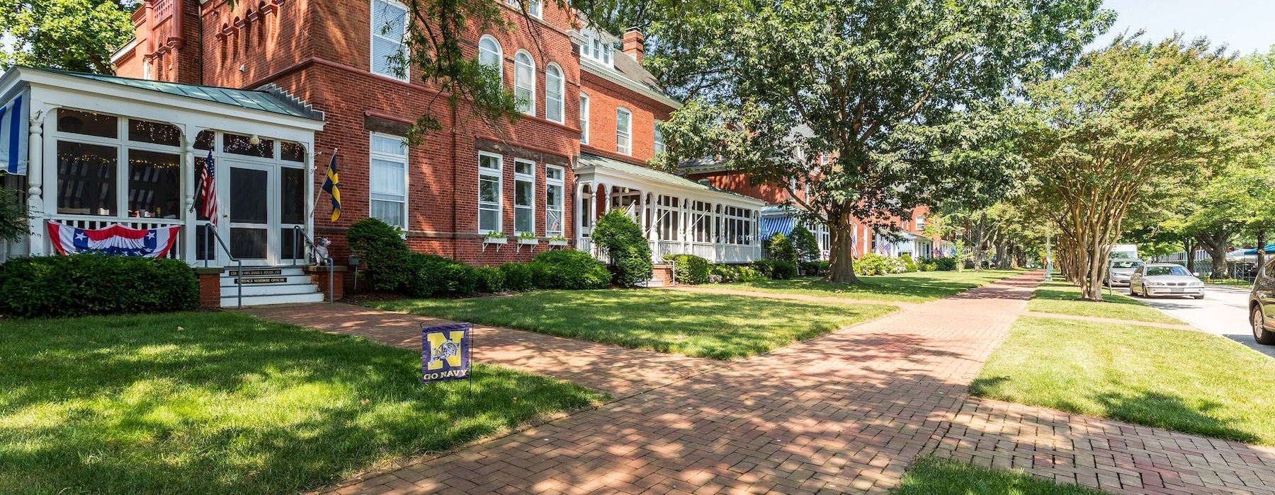 a house with trees and bushes in front of it