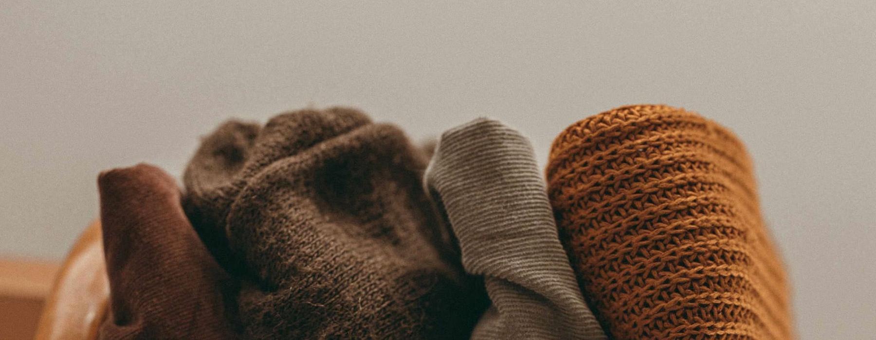 various fabrics and blankets lined up together