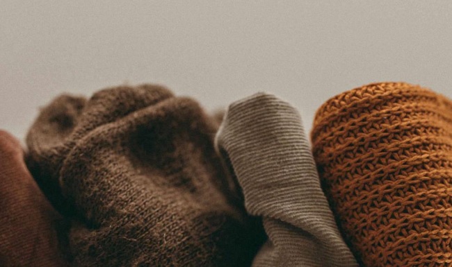 various fabrics and blankets lined up together