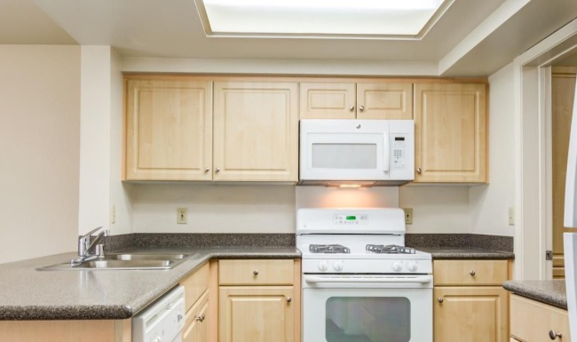 a kitchen with white appliances