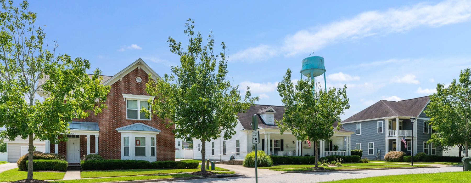 outside of a row of houses, blue sky
