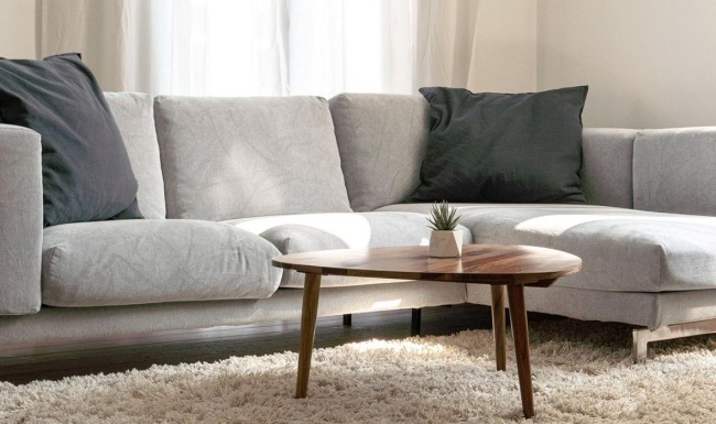 oversized windows brighten spacious, furnished living room