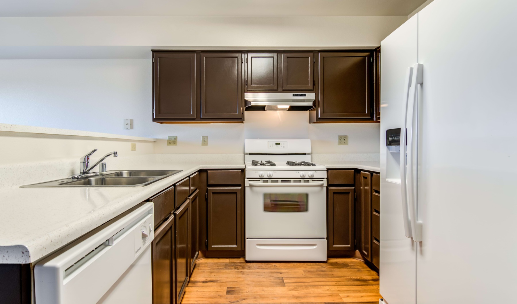 a kitchen with wood cabinets