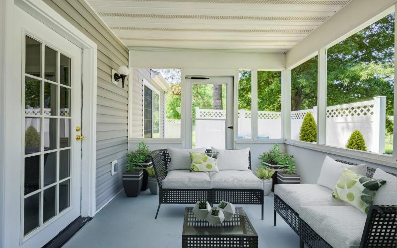 a patio with seating and a table