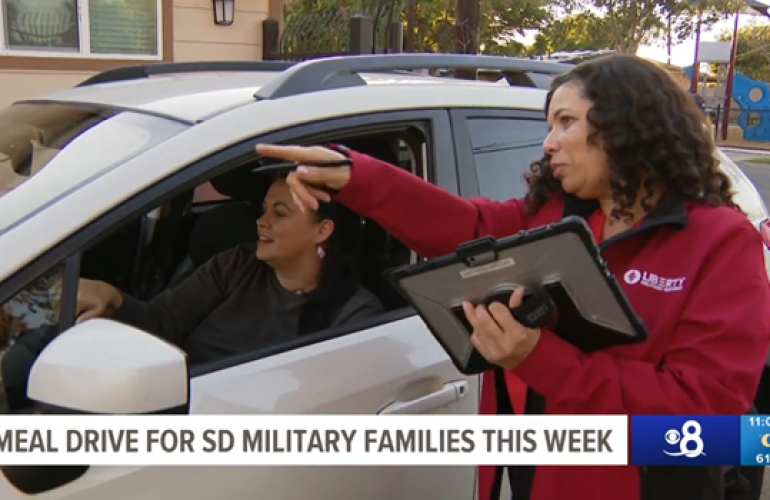 Liberty Team Member Helping Families at the drive thru food event. 