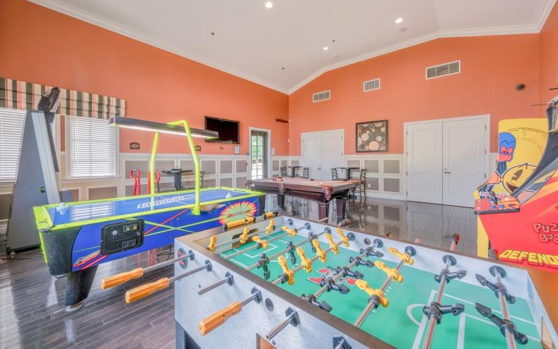 a room with a pool table and a pool table