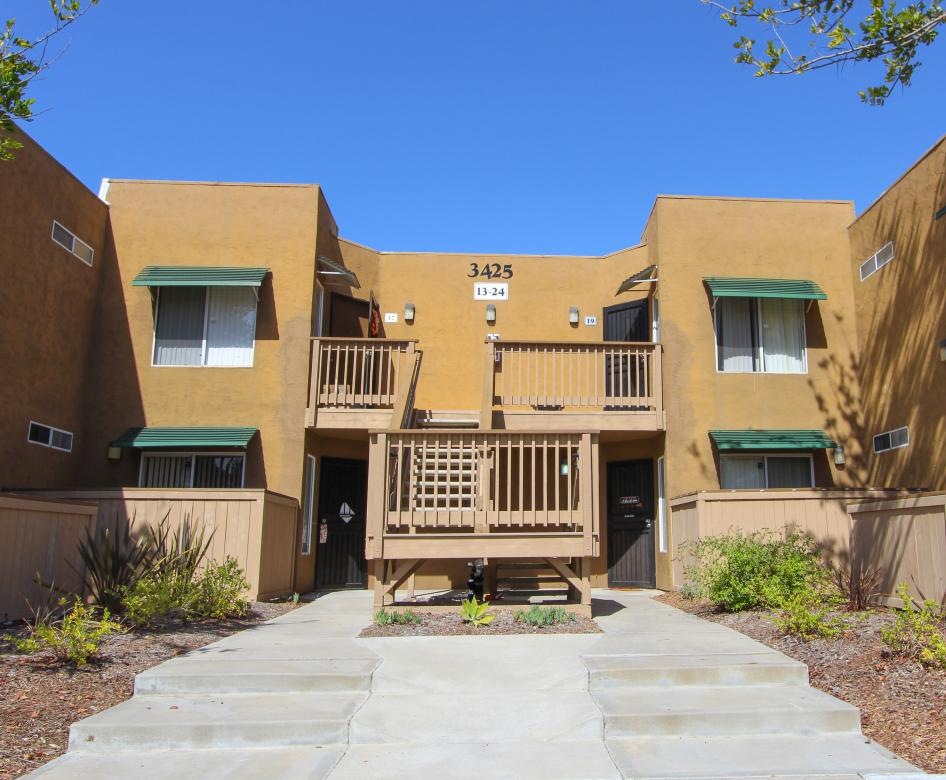 a building with a balcony and steps