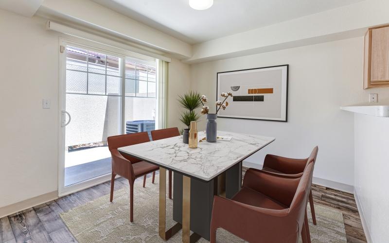 a dining room table with chairs