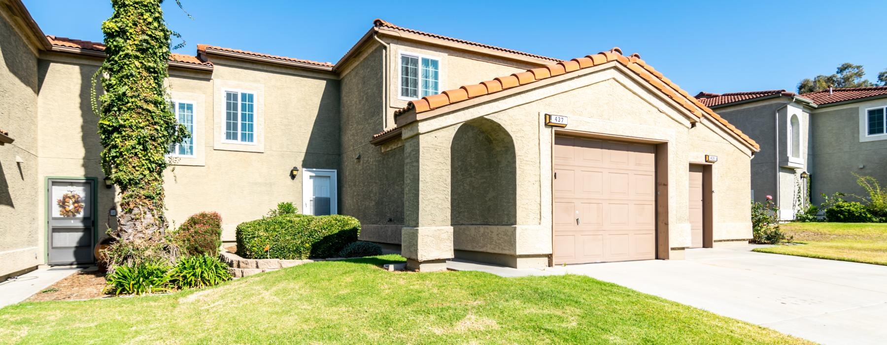 a building with a green yard