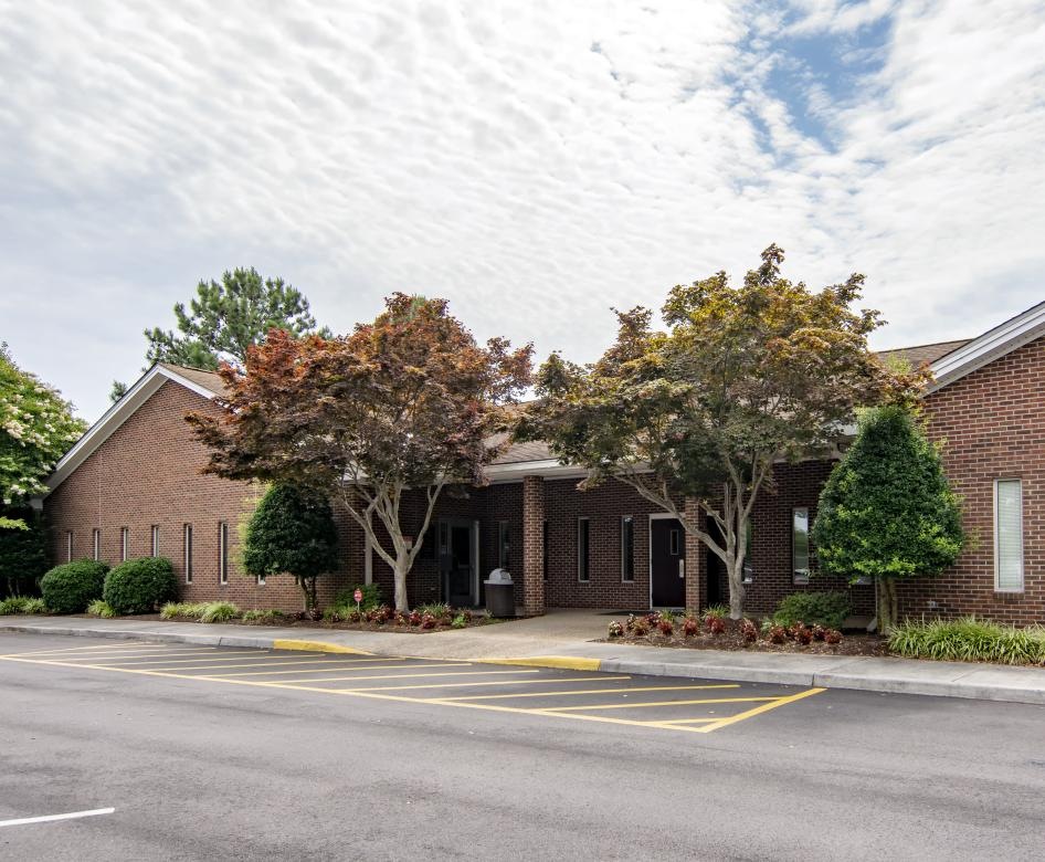 red brick building and parking lot at Fairway Crescent