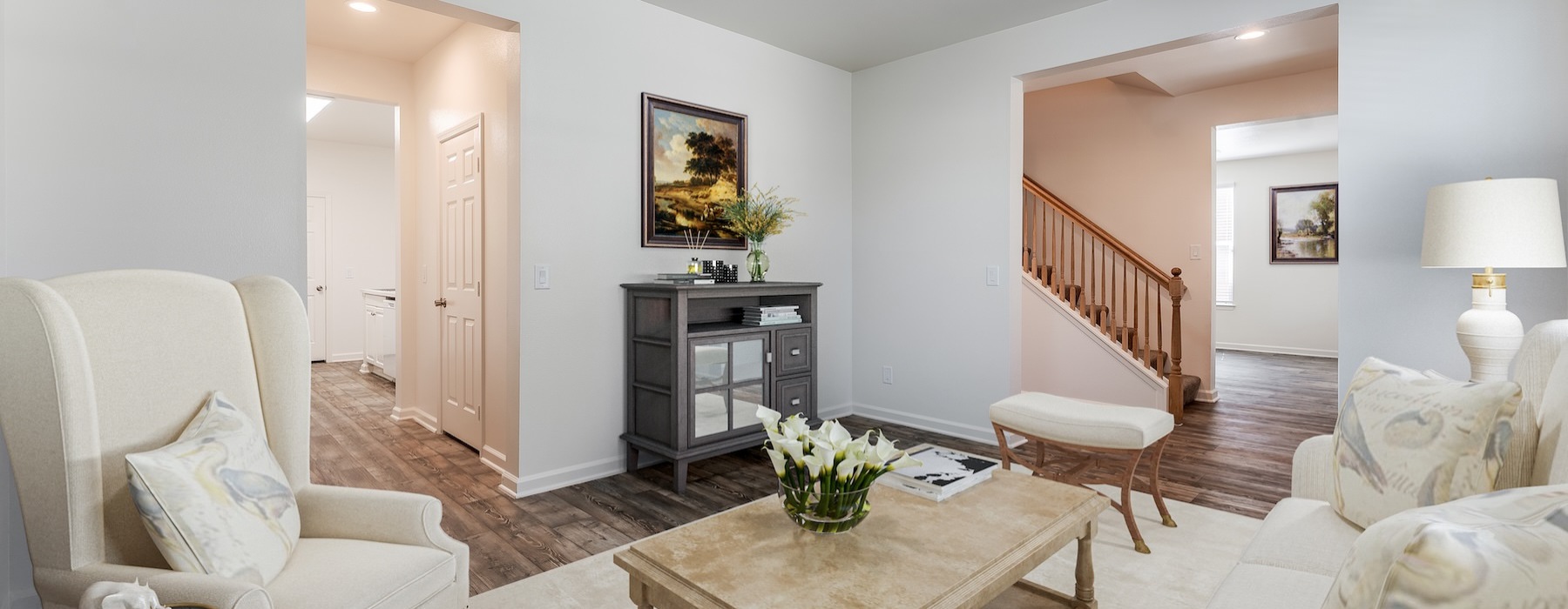 living room with a couch coffee table and chair