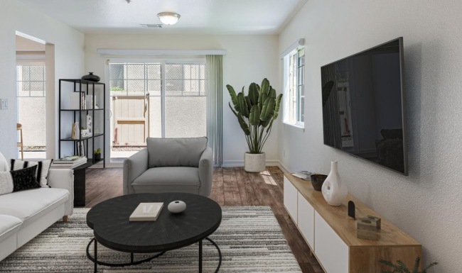 a living room with a tv and couches