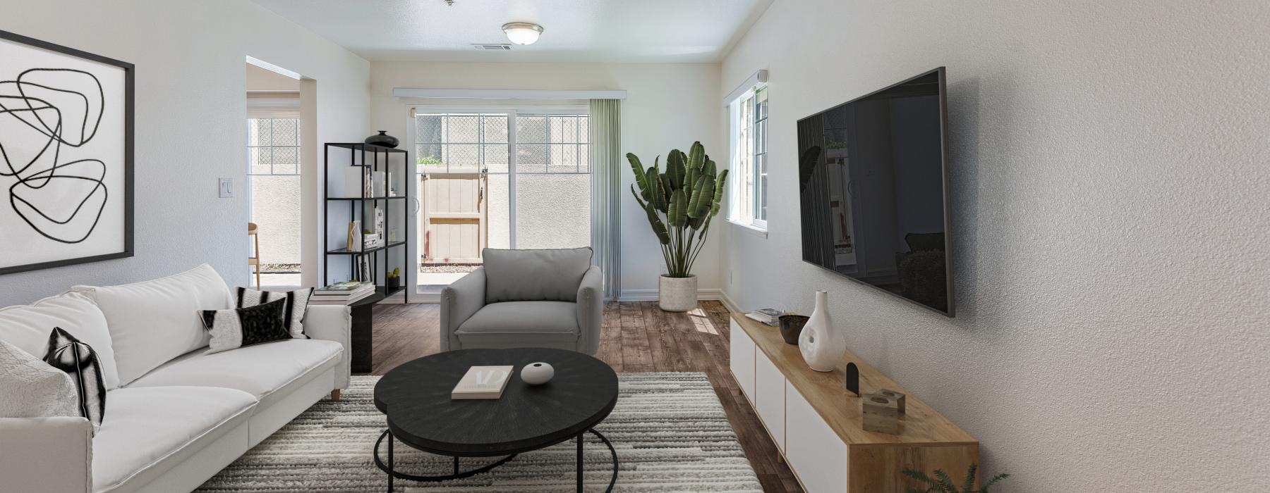 a living room with a tv and couches