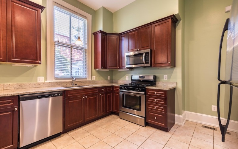 kitchen with window and ample cabinets