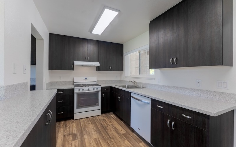 a kitchen with black cabinets